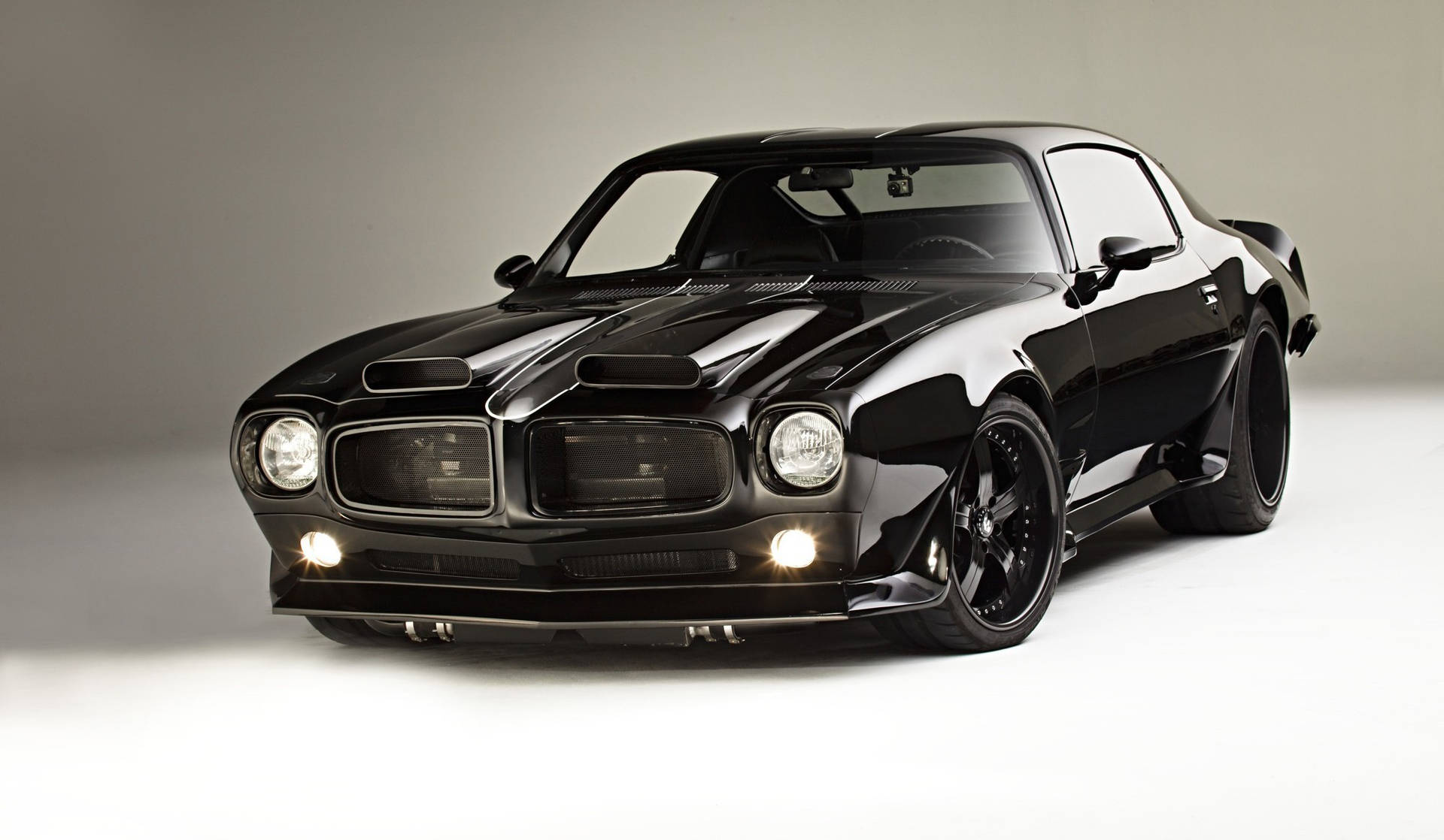 Sleek Pontiac Firebird - A Symbol of Power in Black Wallpaper
