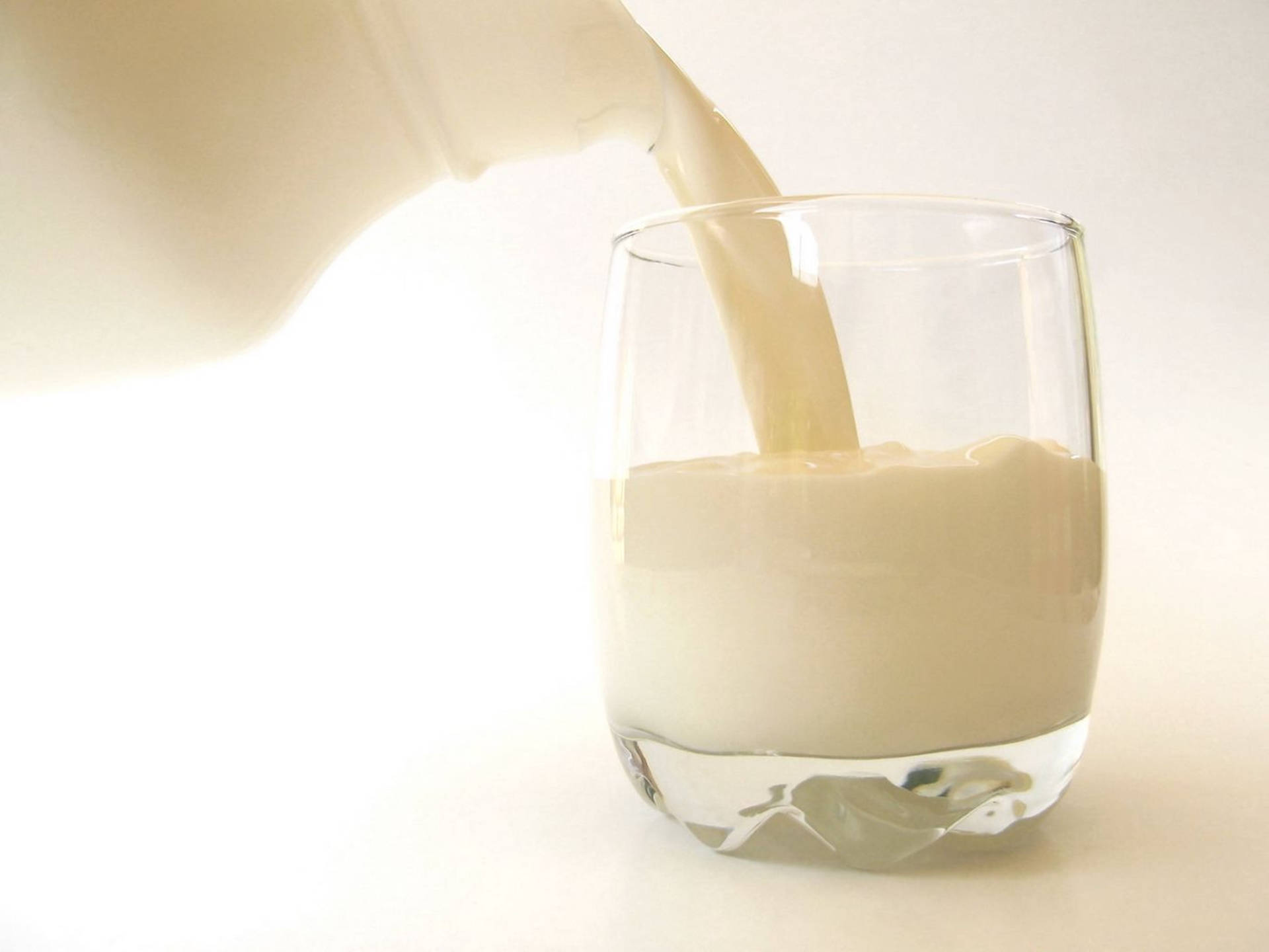 "Refreshing Dairy Pour – Fresh Milk Splash from A Bottle" Wallpaper