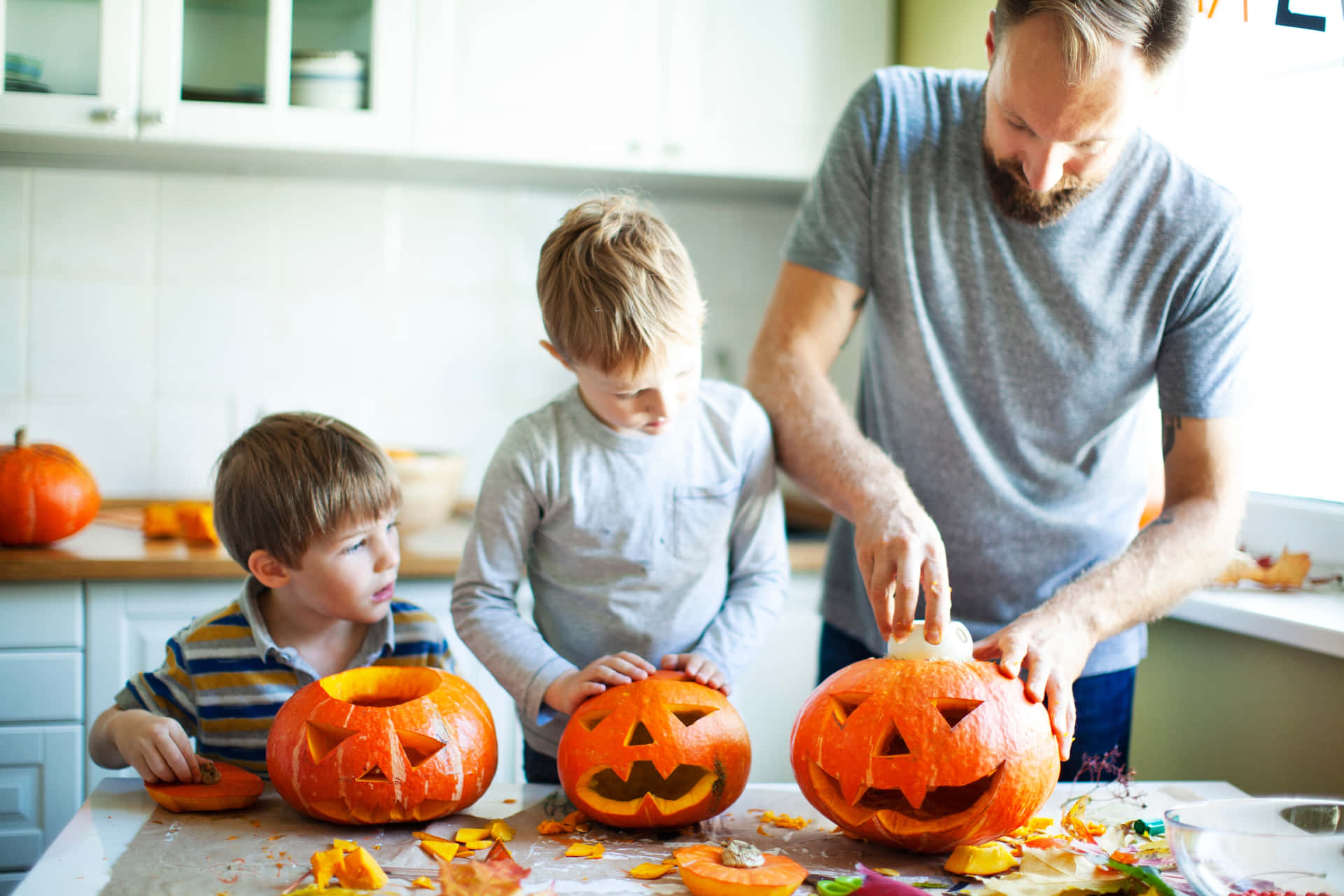 Father Teaching Sons Pumpkin Carving Pictures