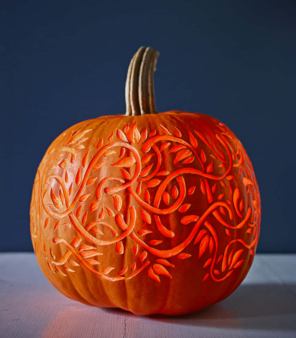 A Pumpkin With A Design On It