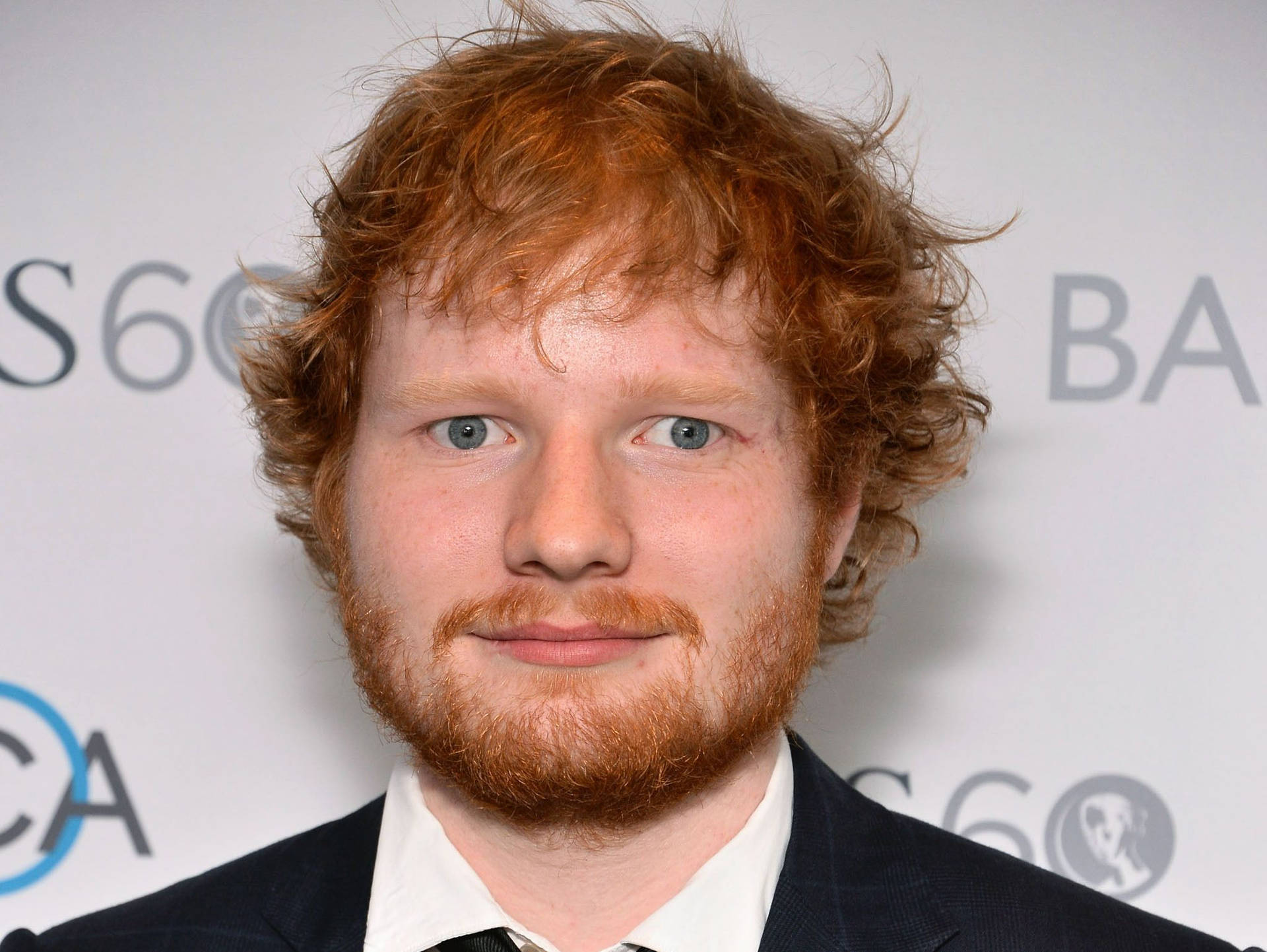 Ed Sheeran Struts The Red Carpet in Style Wallpaper