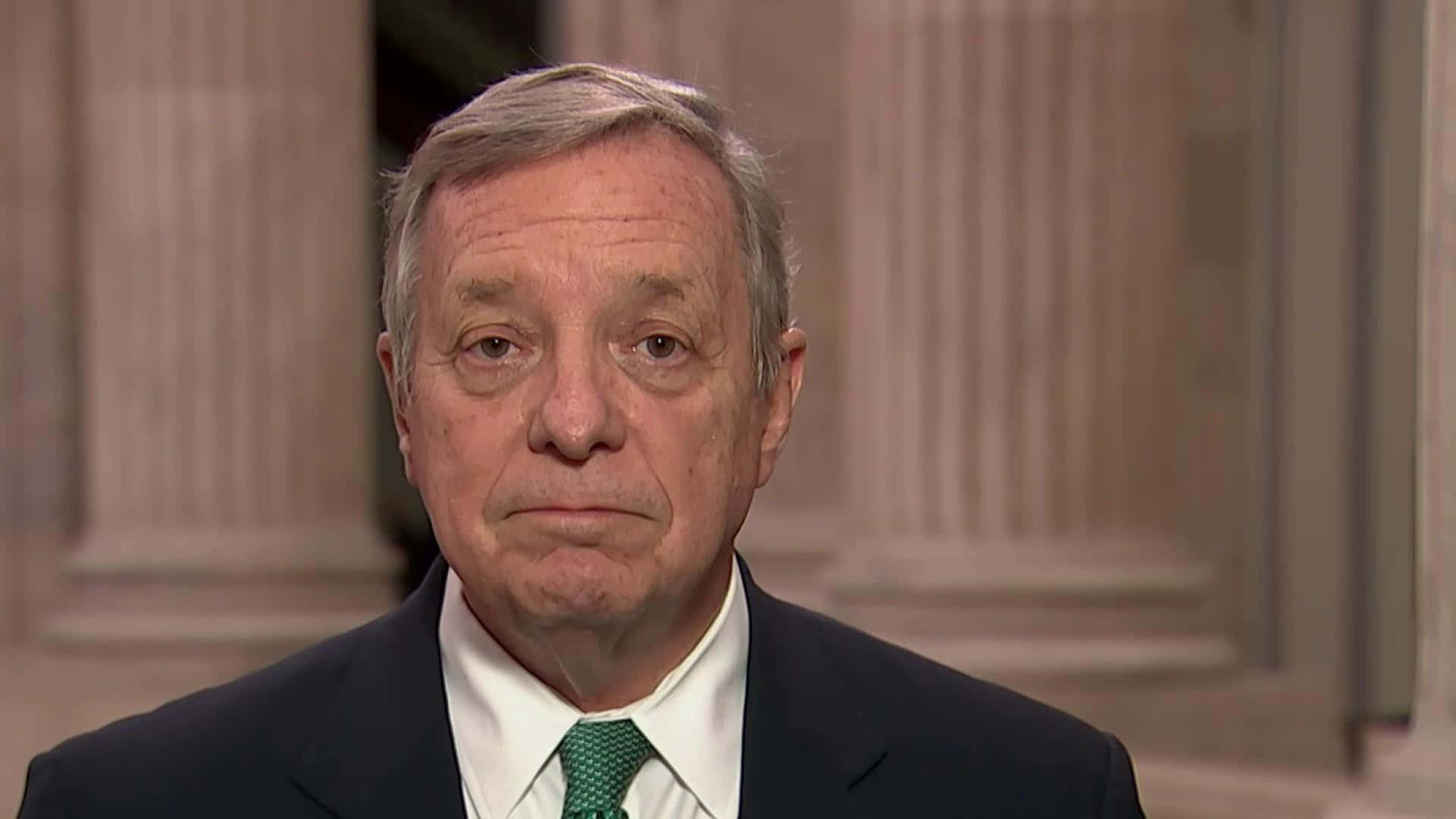 Richard Durbin delivering a speech with a straight face Wallpaper