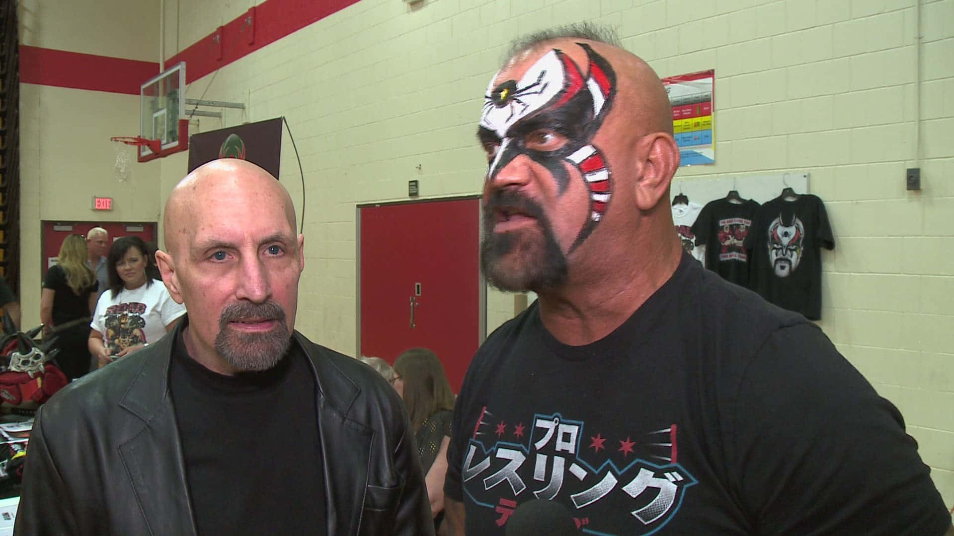 Road Warrior Animal And Manager Talks To Media Wallpaper
