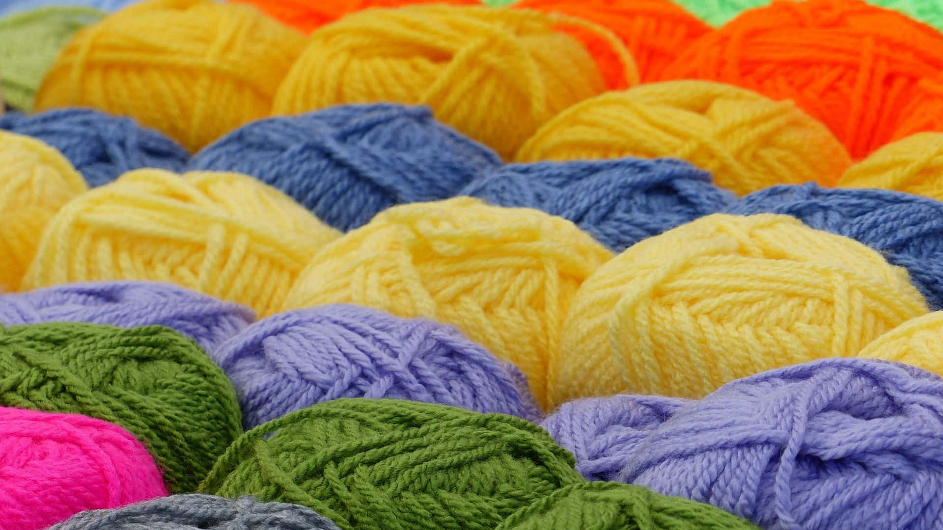 An Array of Knitting Yarns in Selective Focus Wallpaper