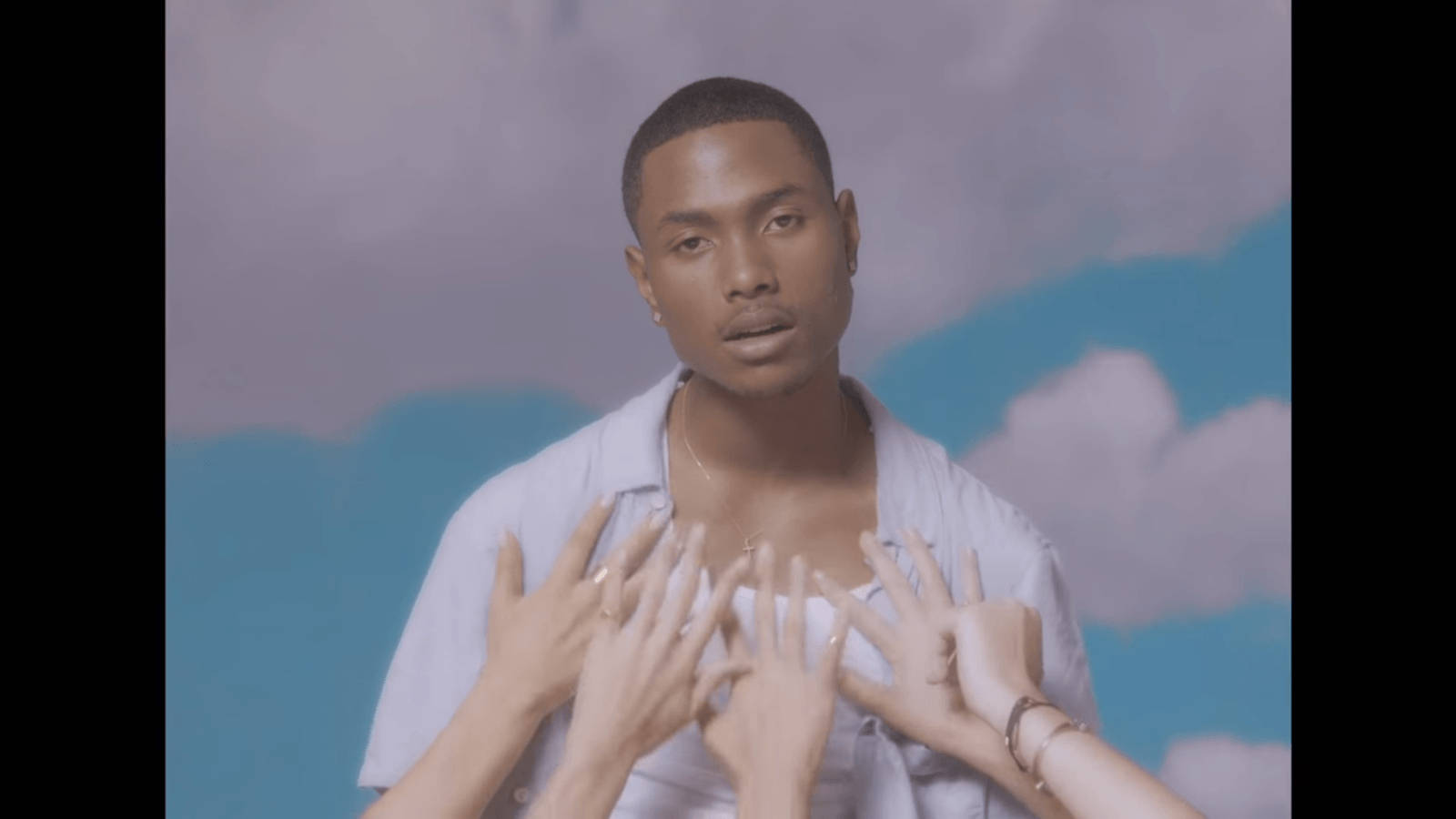 Steve Lacy With Hands Reaching For His Chest Wallpaper