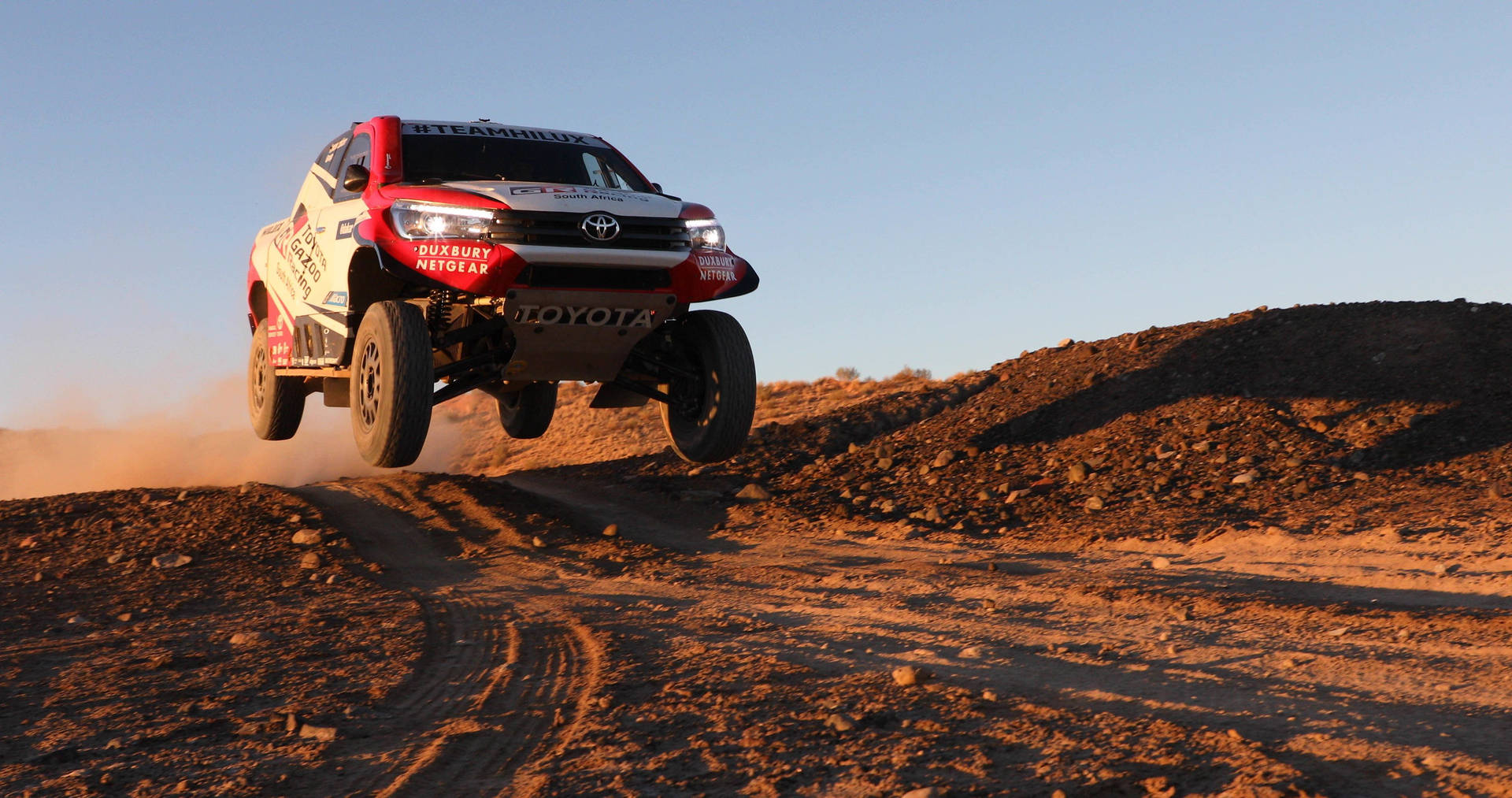 Thrilling Performance by Team Hilux at the Dakar Rally Wallpaper
