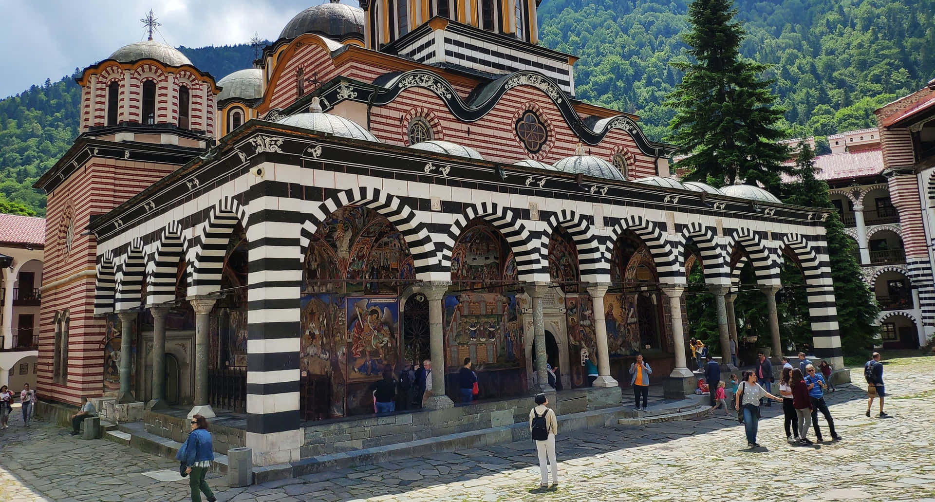 Tourists Outside The Rila Monastery Wallpaper
