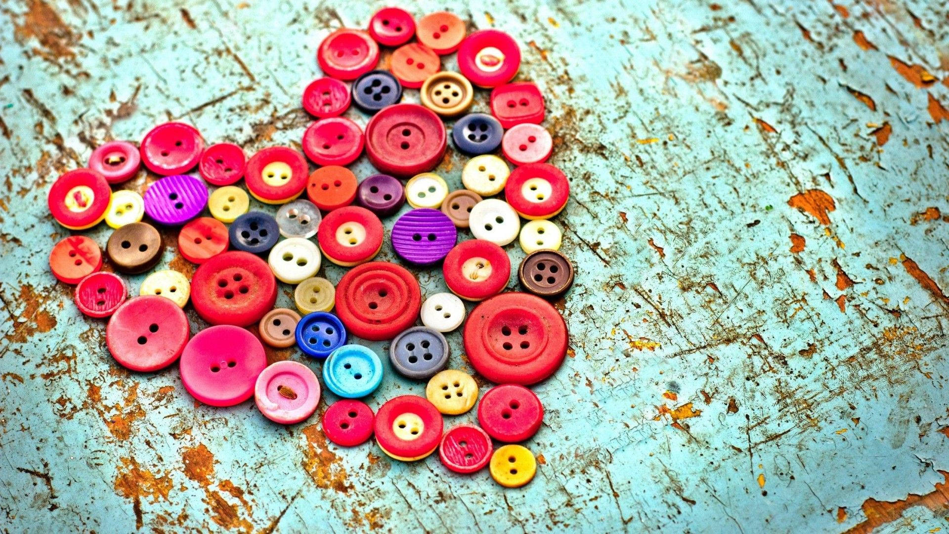 The perfect way to show your love: Vintage each-color heart buttons Wallpaper