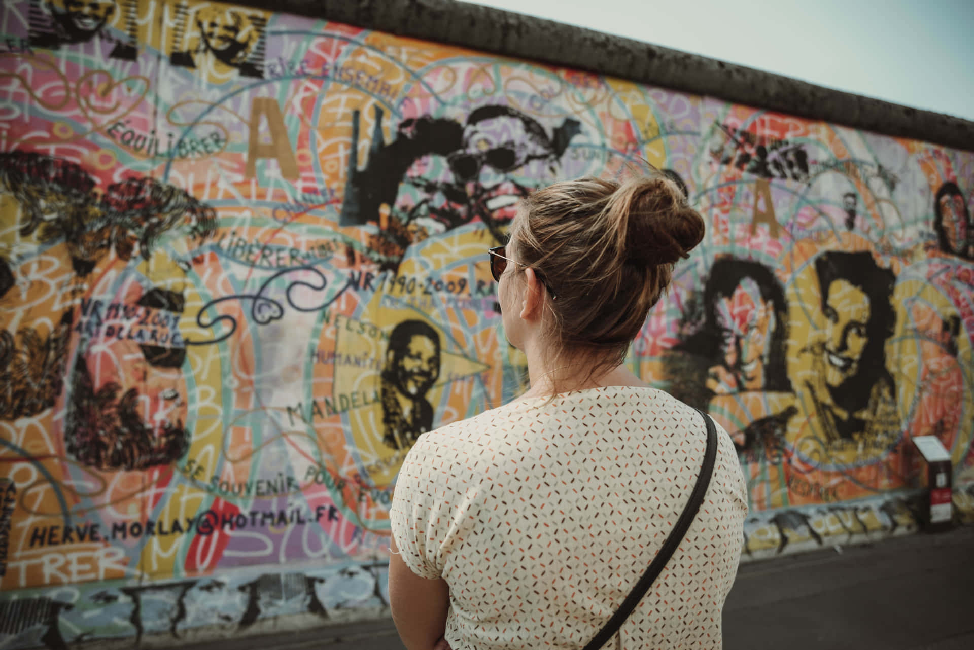 Woman Standing By Berlin Wall Wallpaper